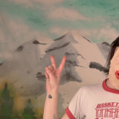 Du Blonde dons a papier-maché mask in the surreal, strangely celebratory video for 'Angel'