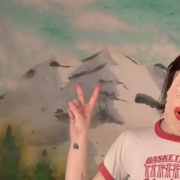 Du Blonde dons a papier-maché mask in the surreal, strangely celebratory video for 'Angel'