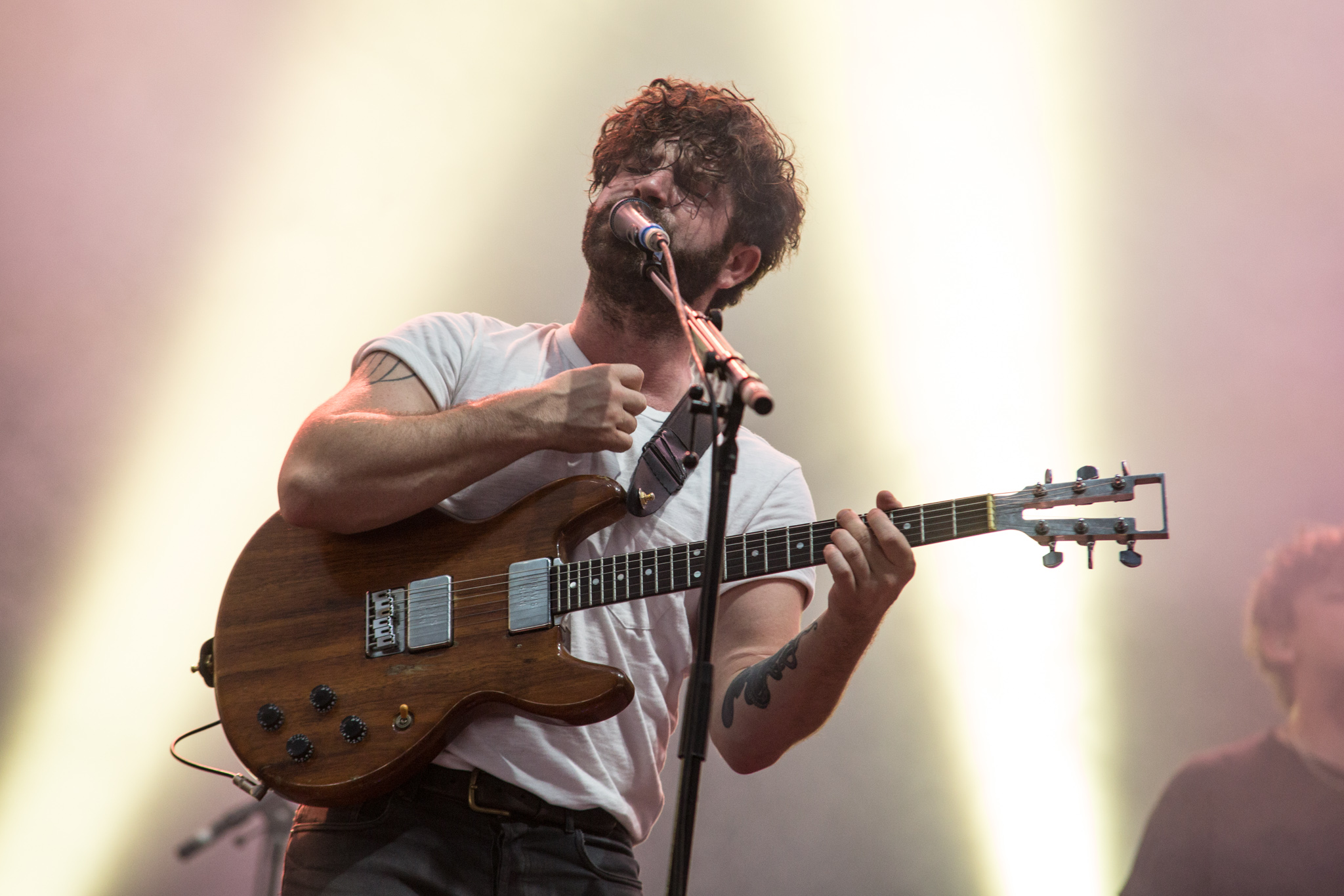 Foals frontman Yannis Philippakis talks “shady macho behaviour” at gigs