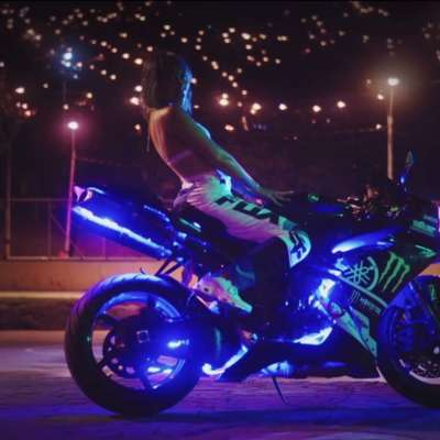 Kali Uchis gets on her bike in the video for ‘Nuestro Planeta’